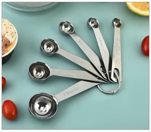 Stainless steel measuring spoons set with clear capacity scales for baking and cooking.