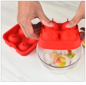 Detail view of the 4-hole round silicone ice ball mold demonstrating easy ice sphere release.