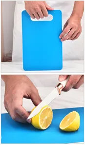 Detailed close-up view of kitchen cutting board showing texture and fruit slicing scene.