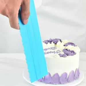Plastic cake scraper tool for DIY baking, blue comb smoother for decorating cakes.