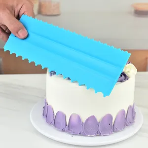 Blue plastic cake scraper and comb set for DIY baking, perfect for smooth frosting and decorating.