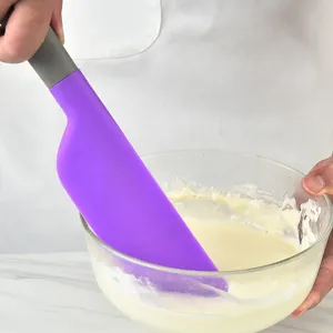 Silicone spatula baking tool for cream mixing and cake making, ergonomic handle.