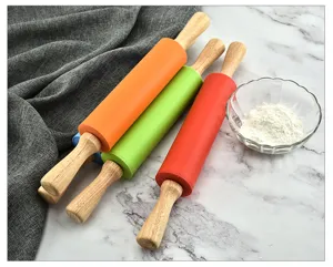 Colorful silicone rolling pin set with wooden handles for baking dough, non-stick kitchen tool.