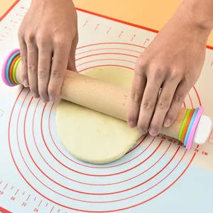 Silicone baking pastry mat with rolling pin set featuring adjustable thickness colored rings.