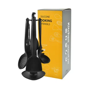 Black silicone kitchen utensils set with holder and yellow packaging box for home cooking.