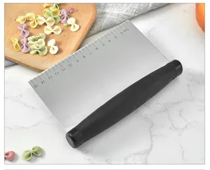 Stainless steel dough scraper with scale markings, baking bench knife for pastry cutting.