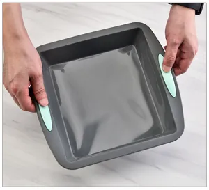 Square non-stick baking pan with silicone handles detail view for cake and bread making