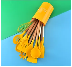 Detailed view of the silicone kitchen utensil set with wooden handles in yellow holder.