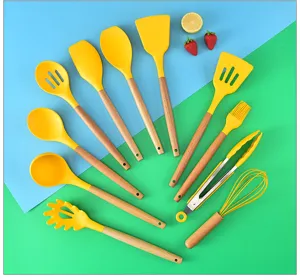 Wooden handle silicone kitchenware set detail showing yellow cooking utensils and spatulas.