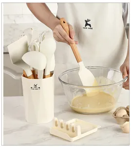 Silicone kitchen utensil set with wooden handles, heat resistant spatula and spoon holder.