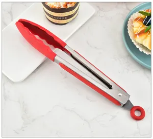 Stainless steel food tong with red silicone head, perfect for kitchen cooking and baking use.