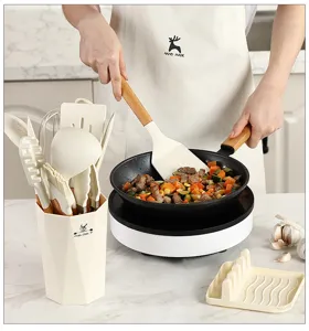 Detailed view of kitchen utensil set in use, featuring heat-resistant silicone and wooden handles.