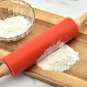 Silicone rolling pin with wooden handle for baking, non-stick kitchen pastry roller tool.