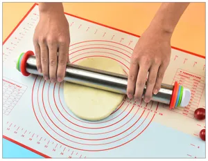 Adjustable stainless steel rolling pin with silicone pastry mat for baking dough effortlessly.