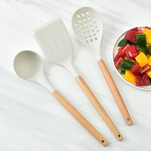 Set de utensilios de cocina de silicona con mango de madera antiadherentes para el hogar