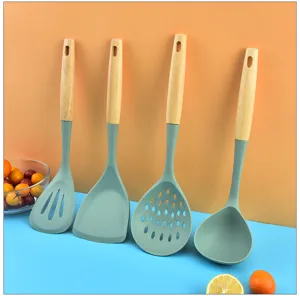 Silicone kitchen utensils set with wooden handle cooking spatula close up detail view