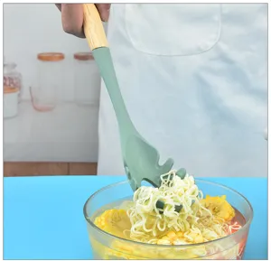 Silicone pasta spoon with wooden handle detail shot, kitchen cooking utensil display clear.