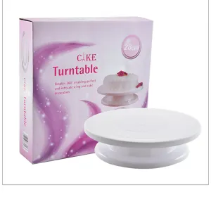 White plastic cake turntable with pink packaging box, 28cm rotary stand for baking decoration.