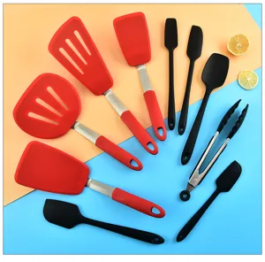 Detail view of silicone kitchen utensil set showing various spatulas and tongs clearly.