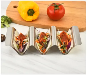 Stainless steel taco holder detail showing wave design and three loaded taco shells.
