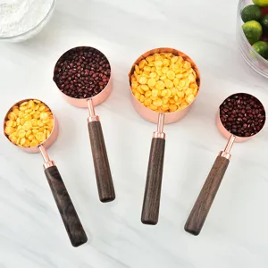 Rose gold measuring spoons with walnut wooden handle set for kitchen baking and cooking use