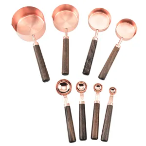 Copper measuring cups and spoons set with wooden handles for baking and cooking kitchen tool