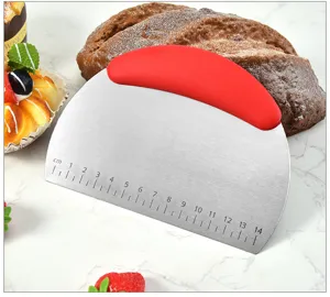 Stainless steel dough scraper with red plastic handle and 14cm scale, essential baking tool detail.