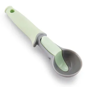 Plastic ice cream scoop kitchen melon baller with trigger release handle in green and grey.