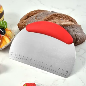 Stainless steel dough scraper with red plastic handle and clear measurement scale for baking.