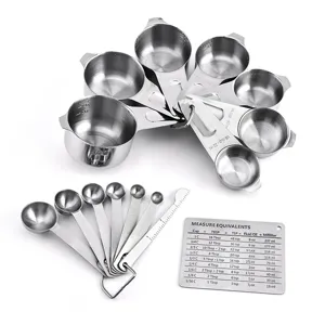 Stainless steel measuring cups and spoons set with conversion chart for kitchen use.