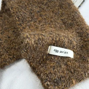 Strick Ohrenwärmer Textur Detail, braune Winter warme Ohrenschützer, kuscheliger flauschiger.