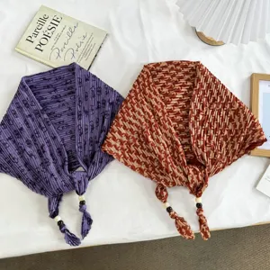 Detailed view of pleated triangle headscarf with beaded ties, vintage style, summer fashion.
