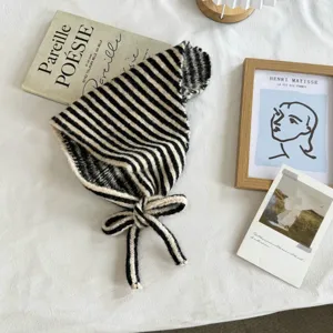 Striped knitted triangular scarf detail, cozy winter headscarf and stylish small shawl.