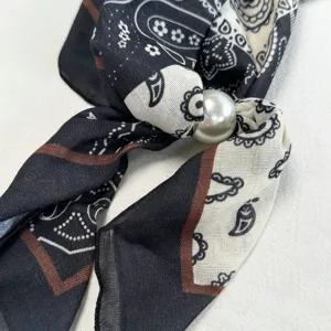Black white paisley print silk scarf with elegant pearl buckle detail for women neckwear.