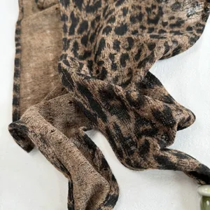 Chic leopard print triangle scarf, lightweight summer sun protection shawl and breathable fashion piece.