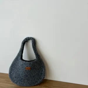Grey fuzzy knit handbag detail, soft texture mini tote bag, everyday casual winter purse.