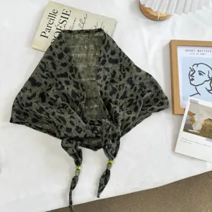 Green leopard print triangle scarf shawl detail view, stylish lightweight accessory for summer.