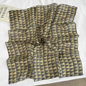 Detail shot of Japanese retro linen square scarf featuring a breathable geometric triangle pattern.
