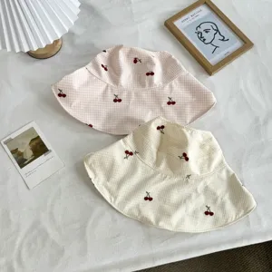 Pink and beige cherry gingham bucket hats, stylish cute summer sun protection hats.