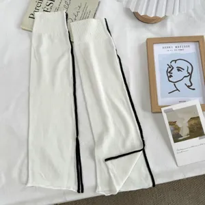 Minimalist solid color knit slouchy leg warmers for women, summer thin split design fashion socks.