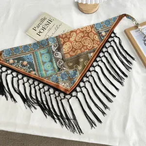 Boho floral paisley print triangular scarf with black fringe and adjustable tassel tie detail.