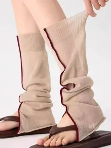 Detailed close-up of knit leg warmers showcasing the stylish split edge and lightweight summer texture.