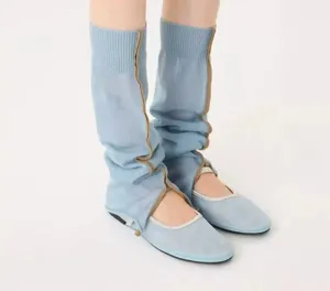 Detailed view of the light blue knit leg warmers showing the trendy split design and soft texture.