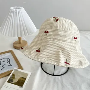 Beige checkered bucket hat with cute red cherry embroidery, sweet style sun protection cap.