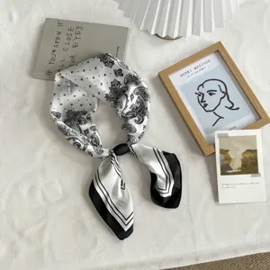 Classic black and white paisley silk scarf, versatile neckerchief and stylish hair accessory.