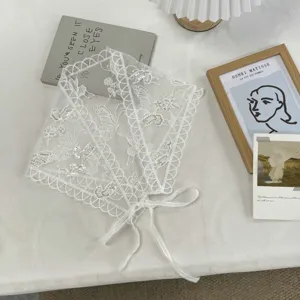 White lace triangular scarf with butterfly embroidery and sequin details, elegant hair accessory.