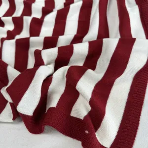 Soft knitted red and white striped shawl, comfortable daily outerwear and versatile accessory.