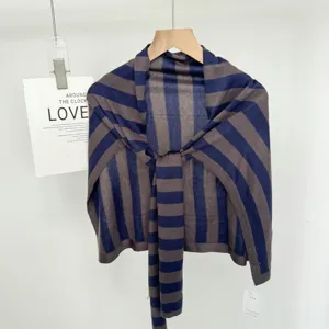 Striped knit shawl detail, soft fabric, blue brown color block, elegant casual drape.