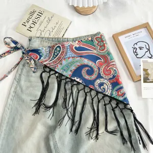 Ethnic style paisley print triangle scarf with black tassels and tie waist design chic.