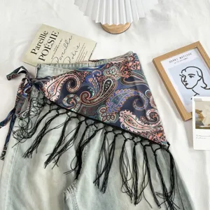 Boho paisley print triangle scarf with black tassel tie, stylish layered waist wrap.